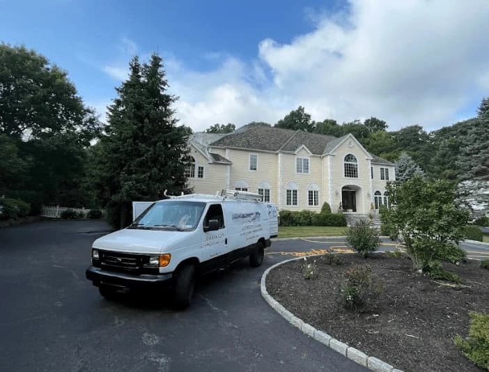 Mayfield Heights Power Washing technician performing thorough gutter cleaning service in Mayfield Heights