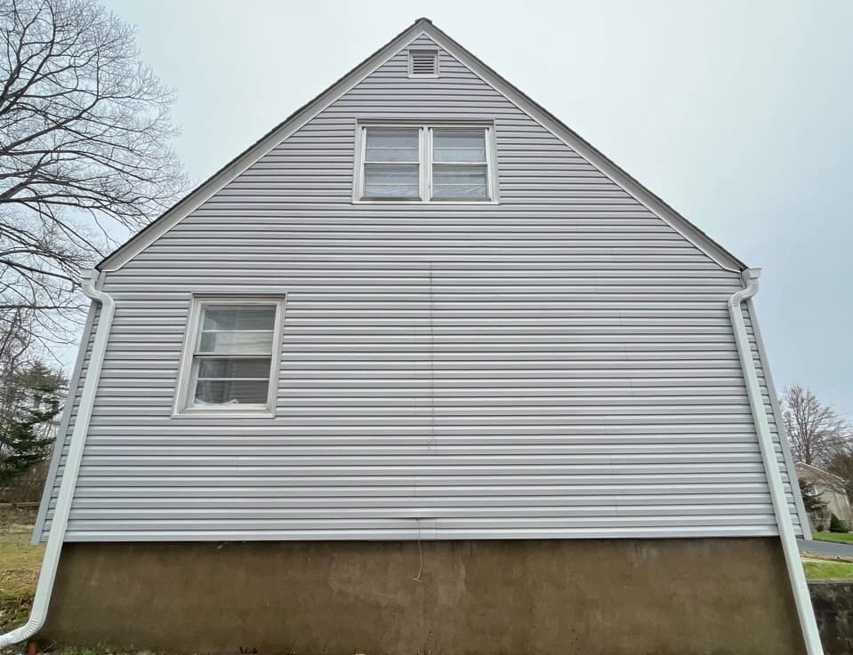 Mayfield Heights Power Washing technician performing detailed house washing in Mayfield Heights residential area